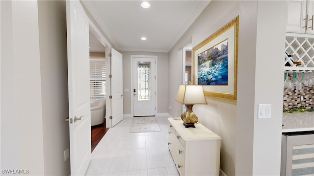 entryway featuring wine cooler and ornamental molding