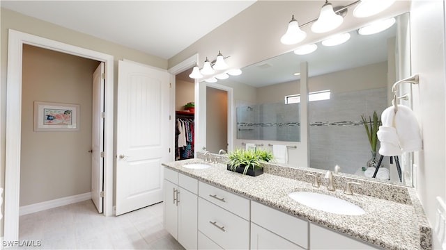 bathroom featuring vanity and a tile shower