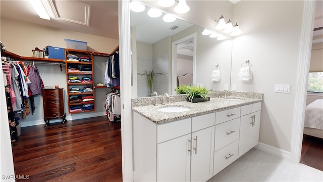 bathroom with vanity and hardwood / wood-style flooring