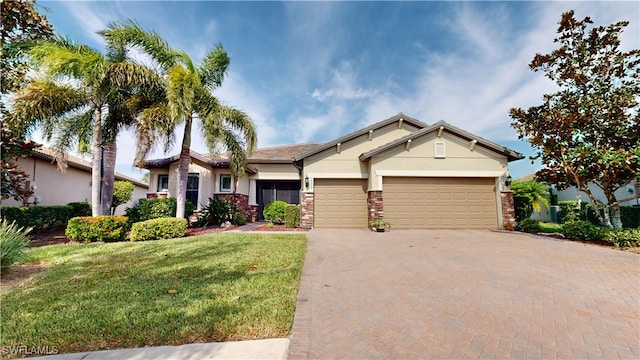 craftsman-style home featuring a garage and a front lawn