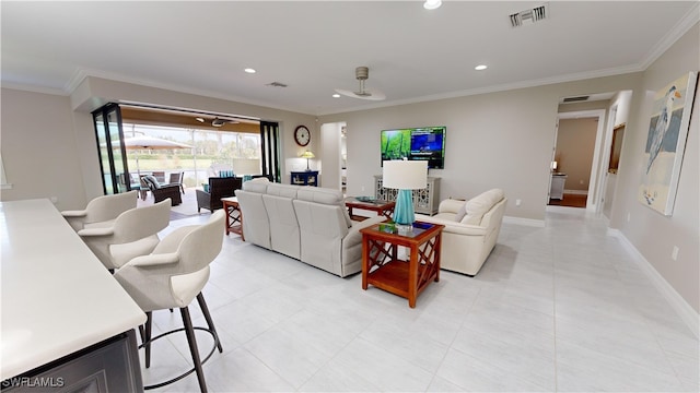 living room featuring crown molding