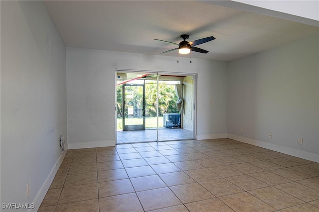 tiled empty room with ceiling fan