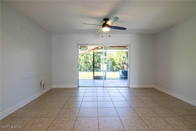 spare room with light tile patterned floors and ceiling fan