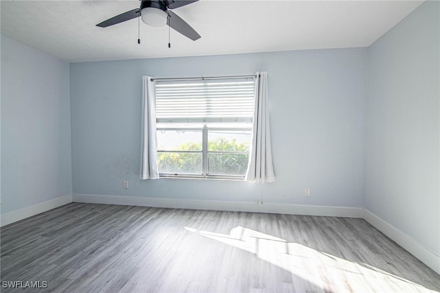 unfurnished room featuring light hardwood / wood-style floors and ceiling fan