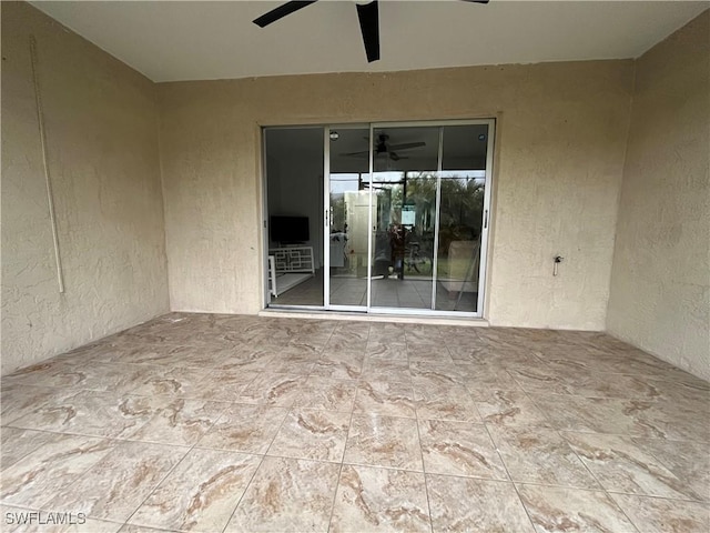 view of patio / terrace featuring ceiling fan