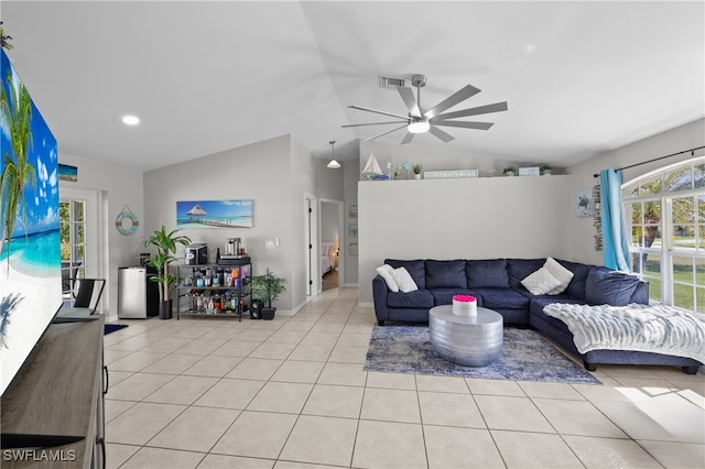 tiled living room with lofted ceiling and ceiling fan