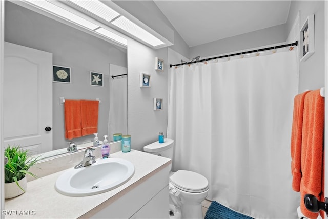 bathroom featuring vanity, toilet, walk in shower, and tile patterned flooring