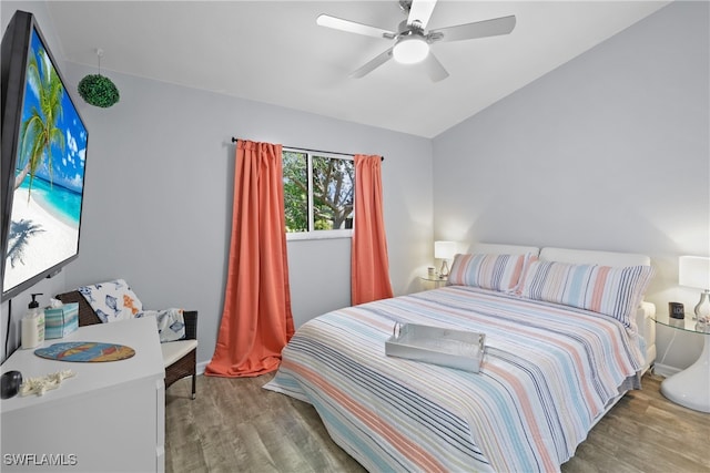 bedroom featuring vaulted ceiling, hardwood / wood-style flooring, and ceiling fan