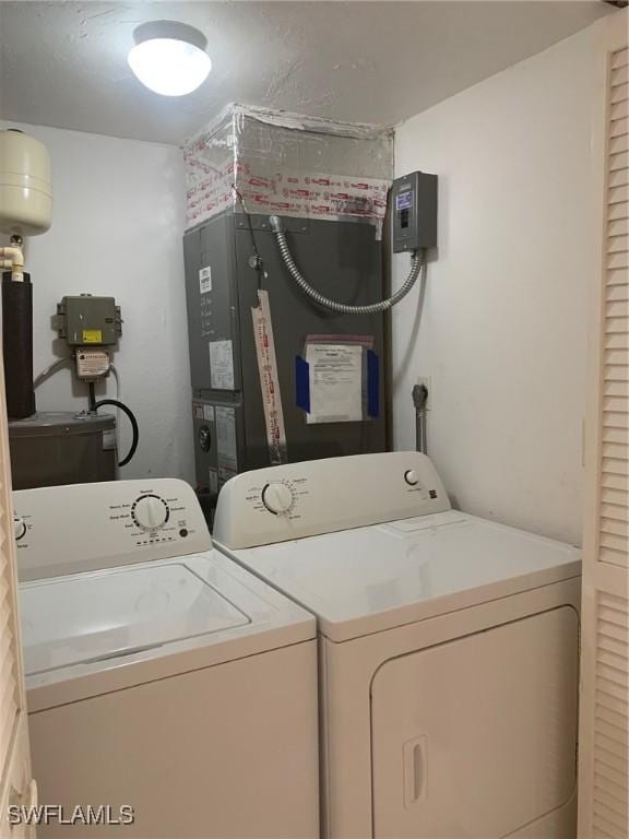 washroom featuring independent washer and dryer