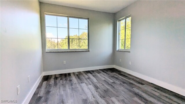 unfurnished room featuring hardwood / wood-style floors