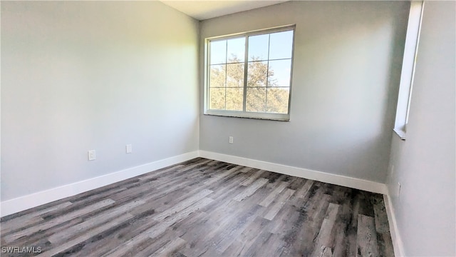 unfurnished room with hardwood / wood-style floors