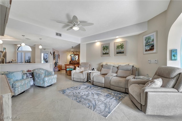 living room with vaulted ceiling with beams and ceiling fan