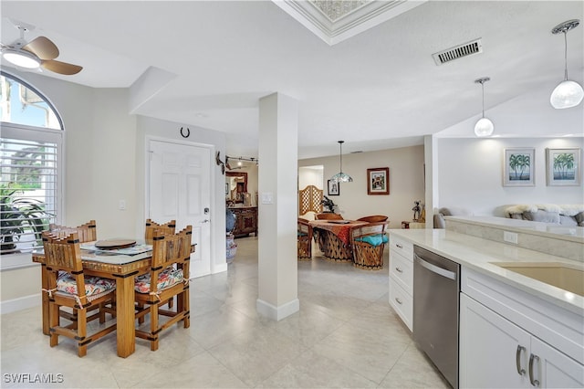 kitchen featuring white cabinets, light tile patterned floors, ceiling fan, stainless steel dishwasher, and decorative light fixtures