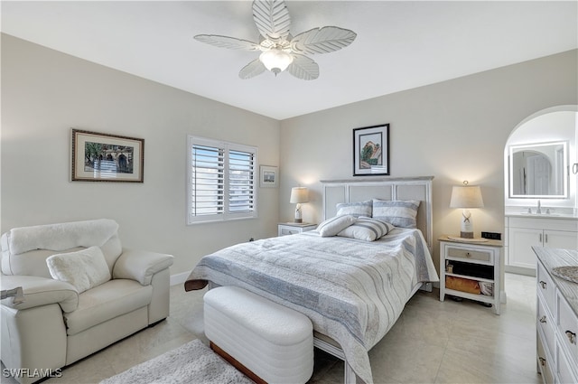 bedroom featuring sink and ceiling fan