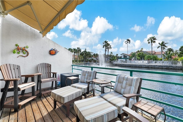 wooden terrace with a water view