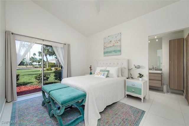 bedroom with access to outside, light tile patterned flooring, lofted ceiling, and ensuite bath