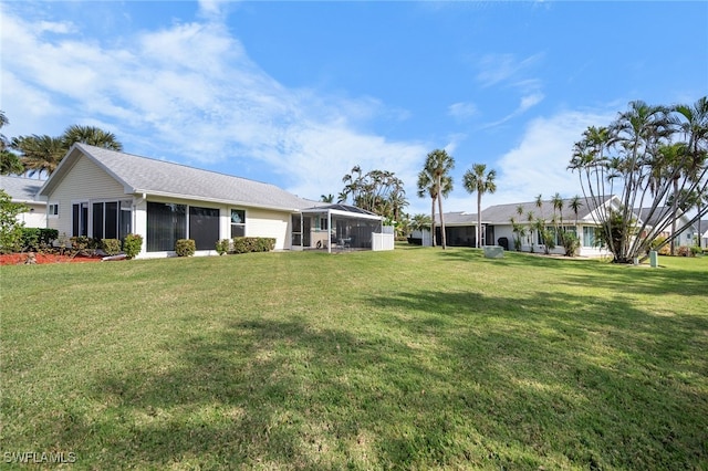 view of yard featuring a sunroom