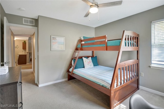 bedroom with light colored carpet and ceiling fan