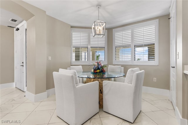 dining space with an inviting chandelier