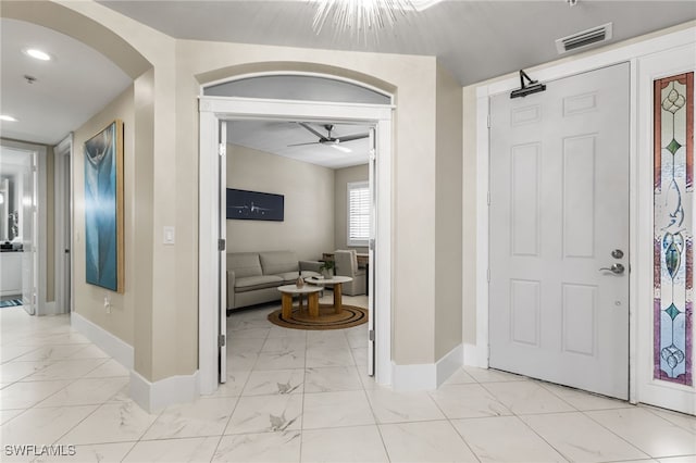 entrance foyer featuring ceiling fan