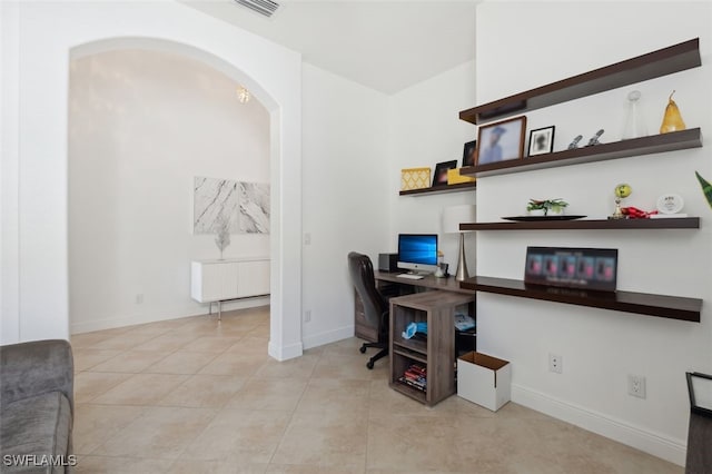 home office featuring light tile patterned flooring and radiator