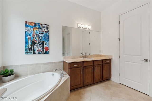 bathroom featuring vanity, a relaxing tiled tub, and tile patterned flooring