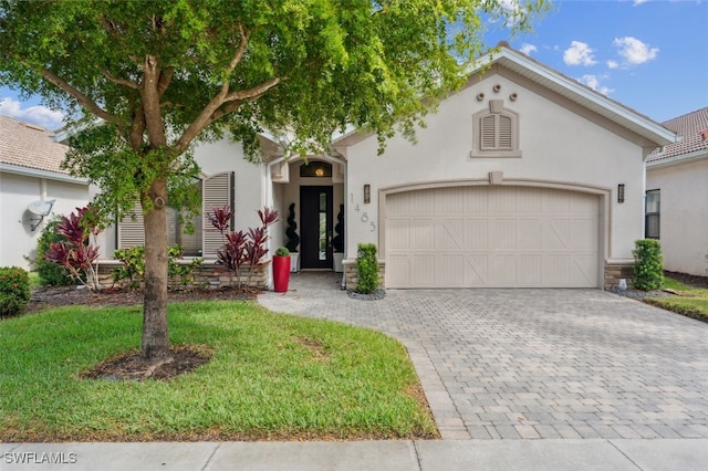 mediterranean / spanish home with a front lawn