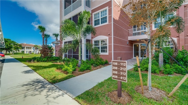 view of property's community with a lawn