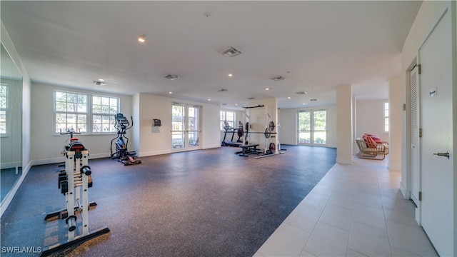 exercise room featuring french doors