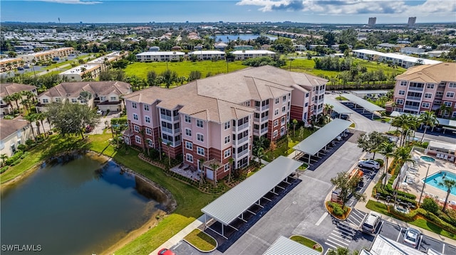 birds eye view of property with a water view