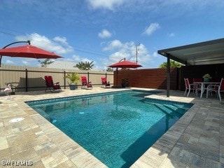 view of swimming pool featuring a patio area