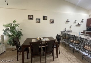 dining area featuring lofted ceiling