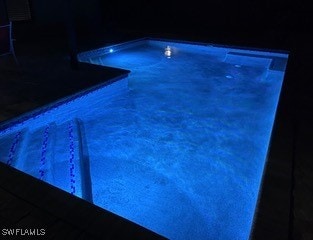 view of pool at night