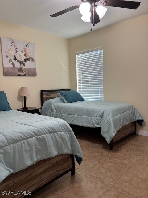 bedroom with light tile patterned floors and ceiling fan