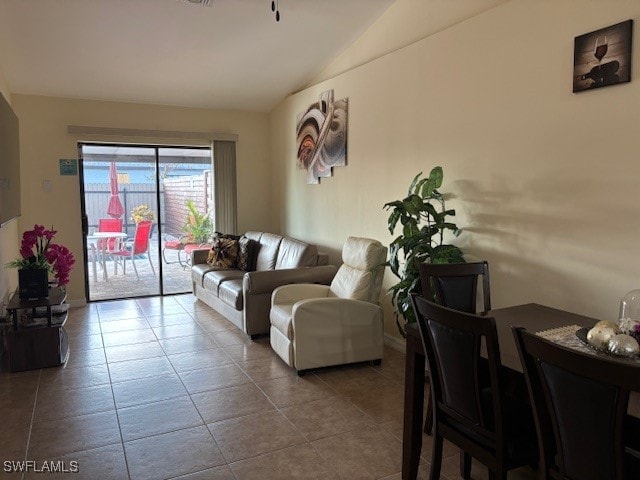 tiled living room with vaulted ceiling