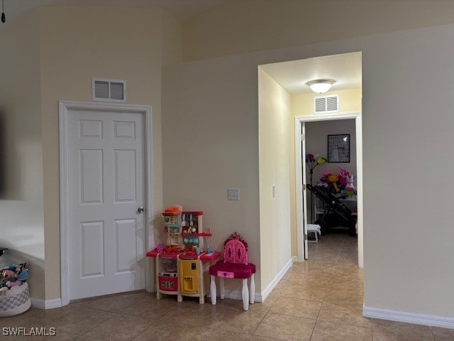 game room with light tile patterned floors