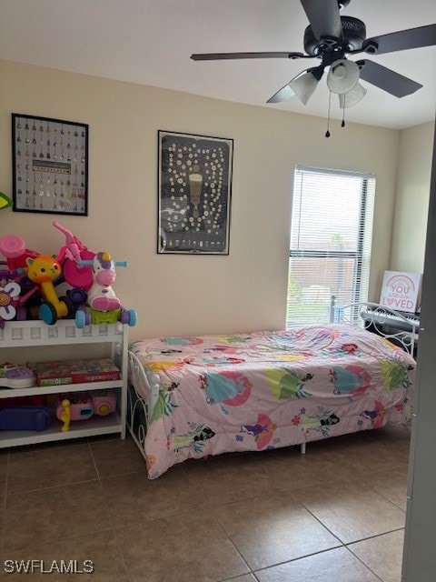 tiled bedroom with ceiling fan