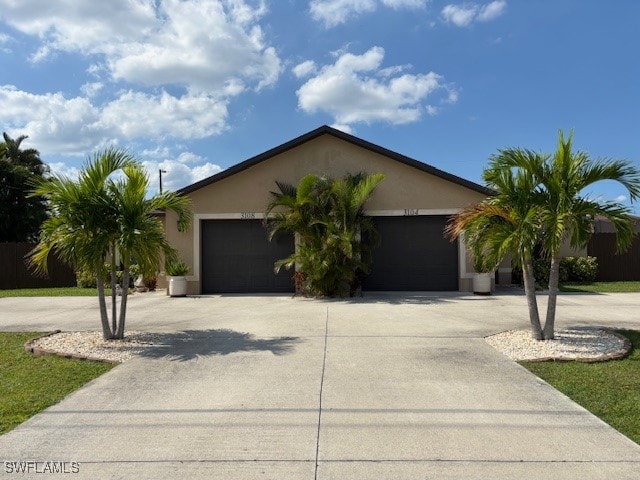 ranch-style home featuring a garage