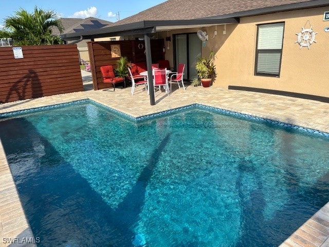 view of swimming pool with a patio