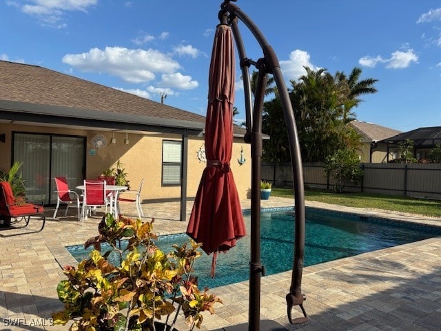 view of swimming pool featuring a patio