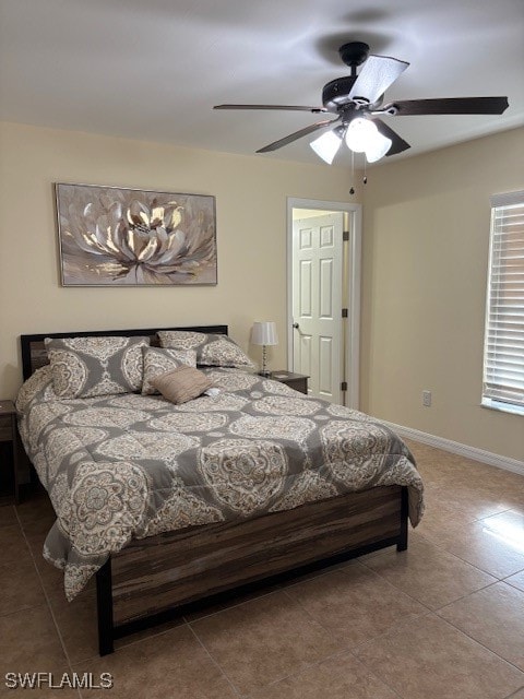 tiled bedroom with ceiling fan