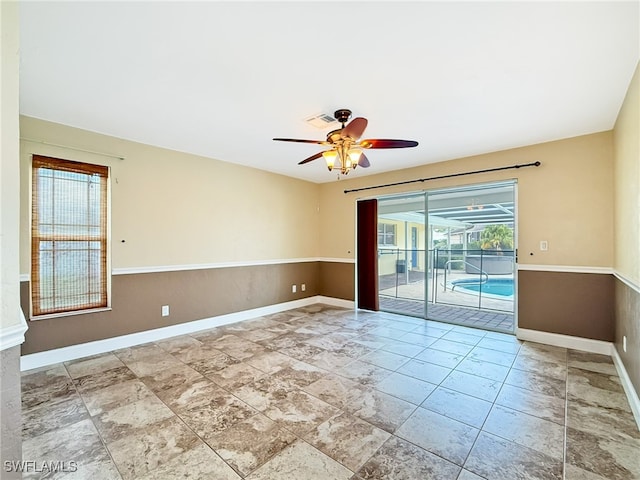 unfurnished room with ceiling fan