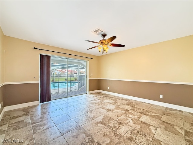 spare room with ceiling fan