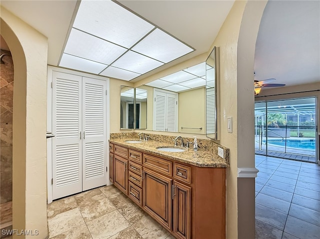 bathroom featuring vanity and ceiling fan