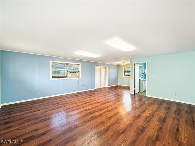 spare room with dark hardwood / wood-style floors