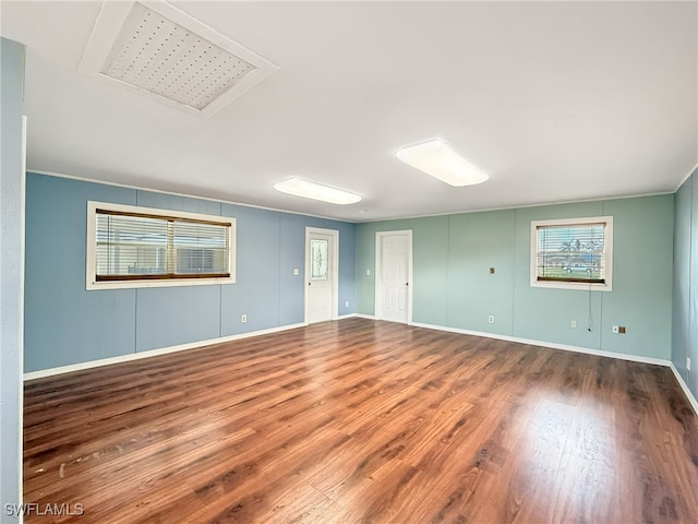 empty room featuring hardwood / wood-style flooring