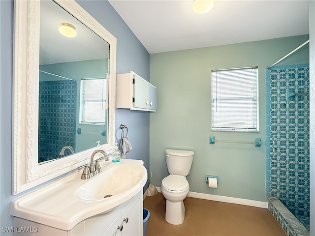 bathroom with vanity, toilet, and walk in shower