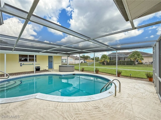 view of swimming pool with a patio, a yard, and glass enclosure