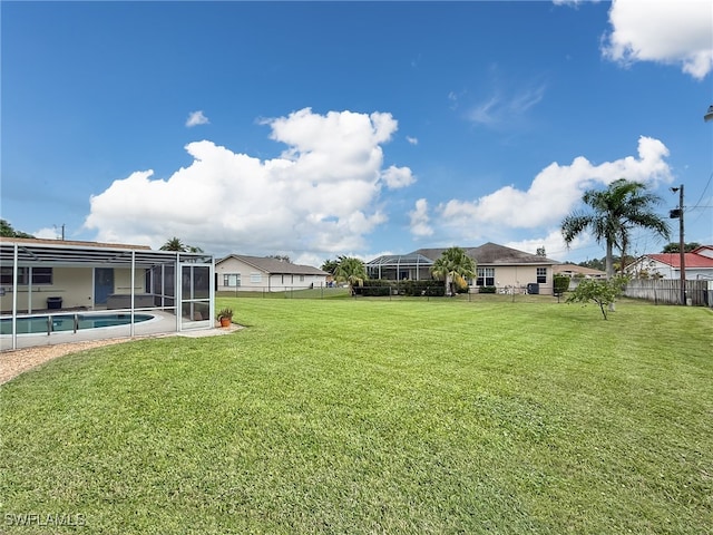 view of yard featuring a lanai and a fenced in pool