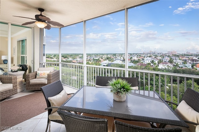 sunroom featuring ceiling fan